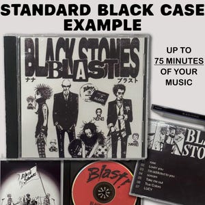May include: A standard black CD case featuring the Black Stones Blast album cover with manga-style illustrations of characters, text reading Black Stones Blast, and a red disc. The set includes a tracklist with songs like Rose and Lucy.