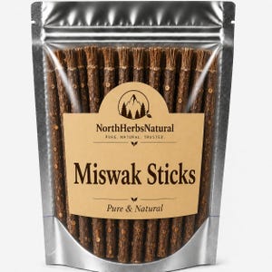 May include: A silver foil pouch containing multiple brown Miswak sticks. The label features the text NorthHerbsNatural, PURE. NATURAL. TRUSTED., Miswak Sticks, and Pure & Natural, along with a circular logo depicting a mountain range and pine trees.