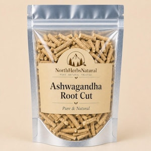 May include: A silver, resealable pouch filled with ashwagandha root cut. The label reads "North Herbs Natural" and "Ashwagandha Root Cut, Pure & Natural". The ashwagandha pieces are light brown and cylindrical.