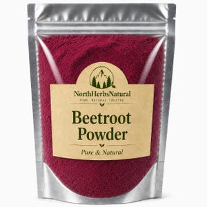 May include: A silver pouch filled with vibrant red beetroot powder. The label reads "NorthHerbsNatural" above "Beetroot Powder, Pure & Natural". The packaging is sealed, suggesting freshness and quality of the product.