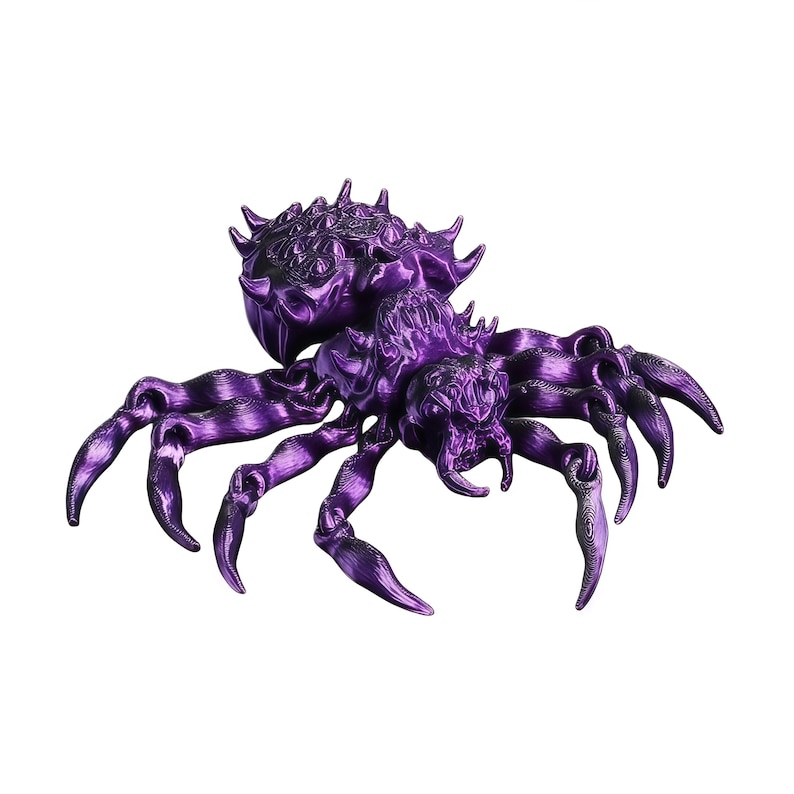 A deep metallic purple fantasy spider with exaggerated legs and a highly detailed back is pictured on a white background.