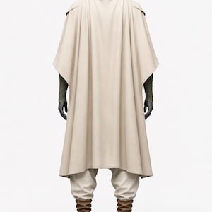 May include: A beige cloak and matching pants with brown boots. The outfit includes a high collar and cape-like design. The model is standing on a black circular base, showcasing the full costume.