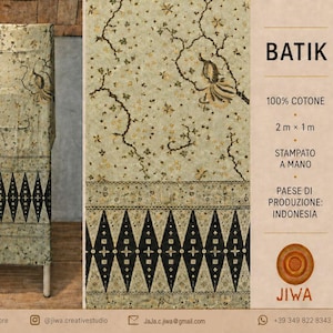 May include: A piece of hand-printed batik fabric measuring 2m x 1m, made of 100% cotton. The textile features a light beige background with dark brown floral patterns and a distinct black geometric border design at the bottom edge.
