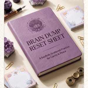 May include: A purple journal titled "BRAIN DUMP RESET SHEET" with a brain and lotus flower design. The journal is surrounded by amethyst crystals, sticky notes, paper clips, a pen, ink, and a fidget spinner. The text "SOULFULLY SCATTERED" is at the top.