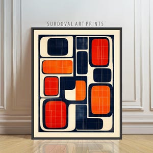 May include: Abstract art print with a black frame. The artwork features a geometric design with orange and navy blue shapes on a cream background. The text "SURDOVAL ART PRINTS" is at the top.