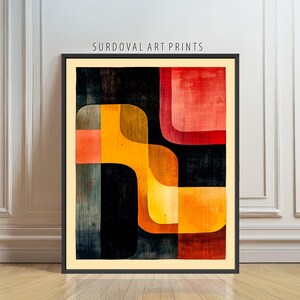 May include: Abstract art print in a black frame. The artwork features a geometric design with orange, yellow, and red shapes against a dark background. The text "SURDOVAL ART PRINTS" is displayed at the top of the frame.