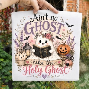 May include: A white t-shirt featuring a graphic of a cartoon ghost wearing a flower crown and reading a book labeled Holy Bible. The design includes pumpkins, a lantern, bats, and lavender sprigs with the text Ain't no GHOST like the Holy Ghost.