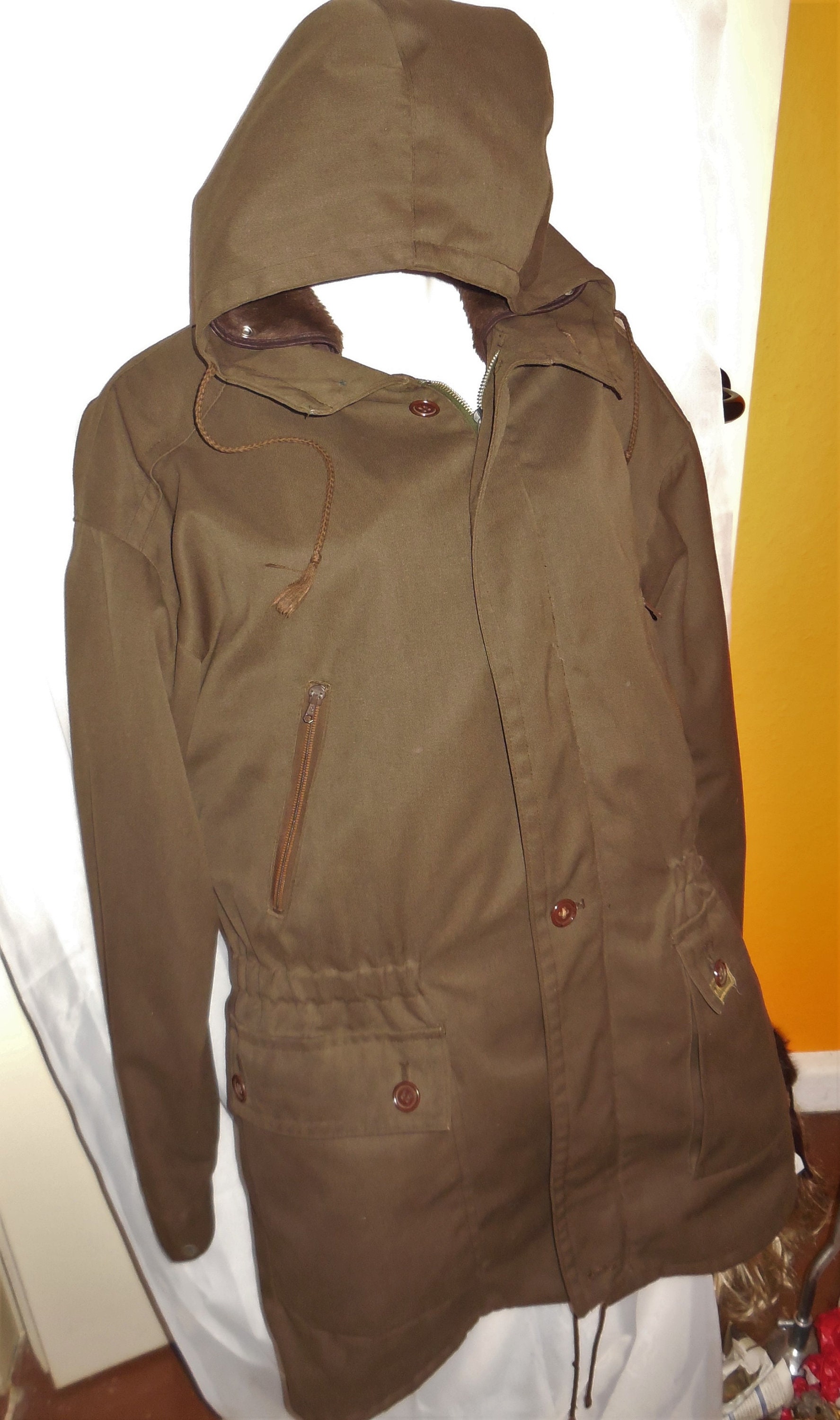 dark green jacket with hood
