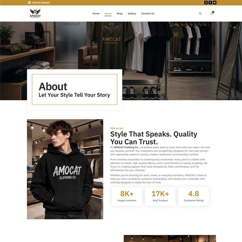 May include: A website interface for AMOCAT Clothing Co. featuring a navigation bar, an About page header, and a section displaying a person wearing a black hooded sweatshirt with the text AMOCAT CLOTHING CO. printed in white on the chest.