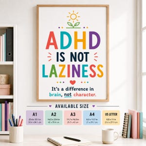 Könnte beinhalten: Ein gerahmtes Wandposter mit dem Text ADHD IS NOT LAZINESS und It's a difference in brain, not character. Das Design zeigt ein Sonnensymbol, ein rotes Herz und bunte Schrift. Darunter listet eine Tabelle die verfügbaren Größen in cm auf: A1, A2, A3, A4.