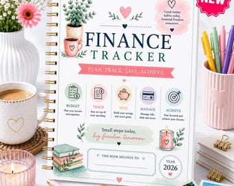 May include: A spiral-bound finance tracker planner with a white cover featuring illustrations of a potted plant, a pink mug, and books. The text reads FINANCE TRACKER, PLAN. TRACK. SAVE. ACHIEVE., and includes sections for budget, track, save, manage, and achieve.