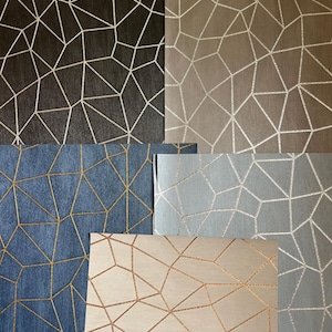 May include: Five samples of wallpaper featuring a geometric pattern of intersecting lines. The colors include dark brown, light brown, blue, gray, and beige, each with metallic-toned lines forming a network of irregular polygons across the surface.