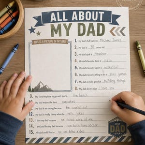 May include: A fill-in-the-blank Father's Day questionnaire titled "All About My Dad" with a space for a photo. The sheet is decorated with blue and green text and graphics. A child is writing on the sheet with a pencil.