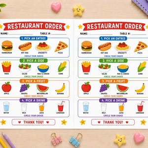 May include: A white paper restaurant order form with two identical columns. Each section features colorful illustrations of food items like hamburgers, hot dogs, spaghetti, pizza, fries, salad, fruit, and drinks with text to circle your choice.