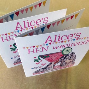 May include: Three pink and white cards with a colorful triangle border. The cards have the text "Alice's HEN weekend!" and a pink cocktail glass with a lime wedge and a high heel shoe with a leopard print design.