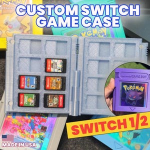 May include: A light blue custom Switch game case with six game cartridges. The case is open, revealing the game cartridges. A purple Game Boy cartridge with a Pokémon graphic is also visible. The text "CUSTOM SWITCH GAME CASE" is at the top.