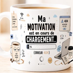 May include: White ceramic coffee mug with the text "Ma MOTIVATION est en cours de CHARGEMENT..." and various graphics, including a laptop, coffee cup, and error message. The mug has a handle and is filled with coffee.