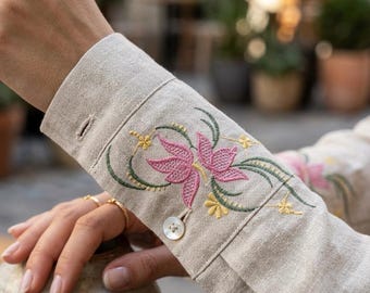 Um delicado desenho de bordado à máquina com uma flor, um padrão de bordado floral, bordado com tema de verão, bordado moderno.
