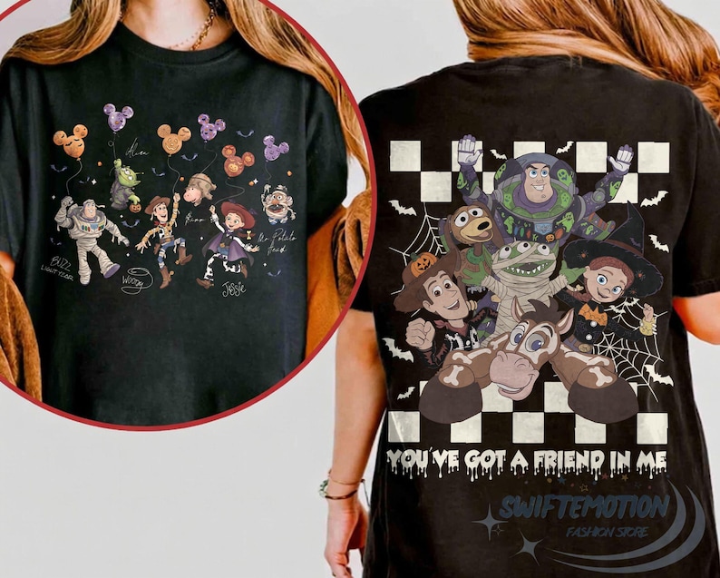 May include: A black t-shirt featuring Toy Story characters in Halloween costumes. The front shows characters with Mickey-shaped balloons. The back displays characters over a checkered pattern with the text "YOU'VE GOT A FRIEND IN ME" in a dripping font.