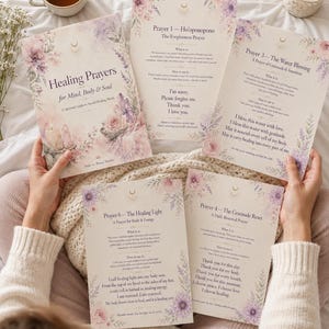 May include: Five printed cards featuring floral illustrations in shades of purple and pink, with text including Healing Prayers for Mind, Body & Soul, Prayer 1 Ho'oponopono, Prayer 3 The Water Blessing, Prayer 4 The Gratitude Reset, and Prayer 6 The Healing Light.