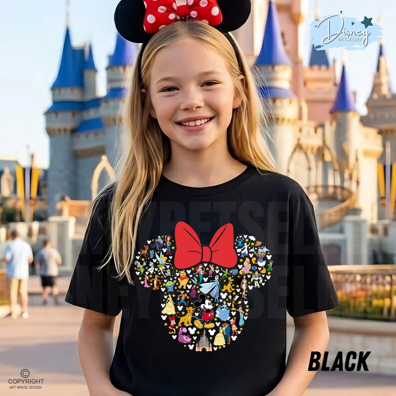 May include: A young person wearing a black t-shirt with a Minnie Mouse design. The design features a red bow and a collage of Disney characters. The person is also wearing a Minnie Mouse ear headband with a red bow. The word "BLACK" is printed on the shirt.