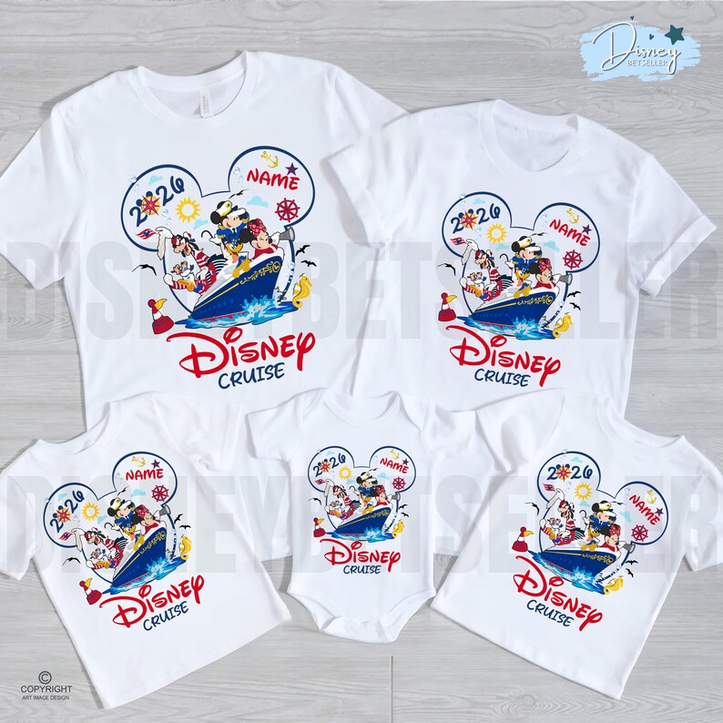 May include: A collection of white t-shirts and a baby bodysuit featuring a graphic of Disney characters on a cruise ship inside a Mickey Mouse ear outline. The design includes the text 2026, NAME, and Disney Cruise in red and blue colours.
