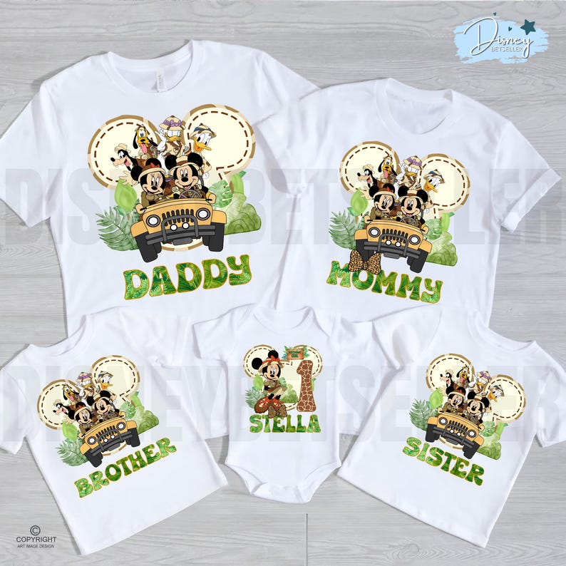 May include: White family t-shirts featuring a Mickey Mouse safari design. The shirts are labelled "Daddy", "Mommy", "Brother", and "Sister". A baby onesie is also included, featuring Mickey Mouse and the name "Stella" with the number "1".