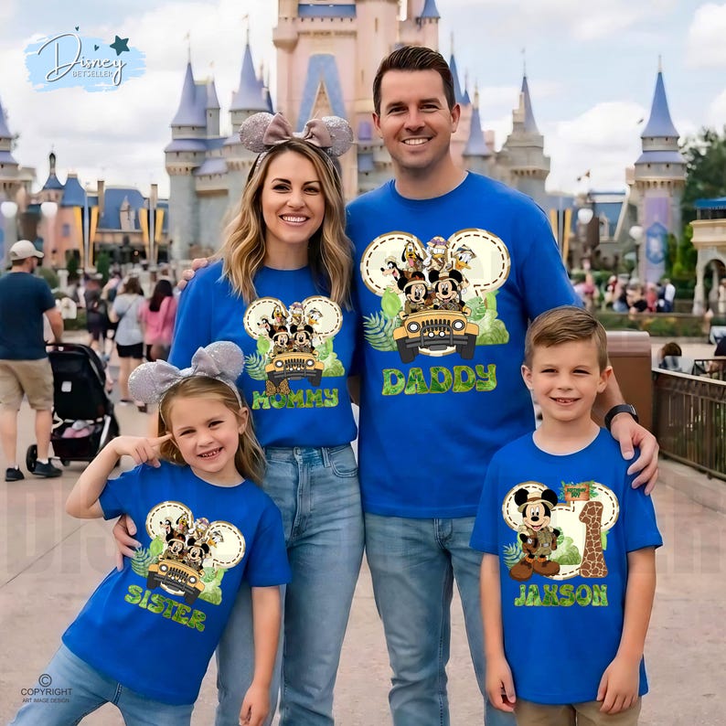 May include: A family of four wearing matching blue t-shirts with Disney character designs. The shirts feature Mickey Mouse, Donald Duck, and other characters in a jeep. The shirts say "Mommy", "Daddy", "Sister", and "Janson".