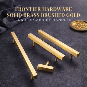 May include: Three brushed gold solid brass cabinet handles and one T-bar knob. The text FRONTIER HARDWARE SOLID BRASS BRUSHED GOLD LUXURY CABINET HANDLES is displayed at the top. The hardware features a linear, rectangular design with a matte finish.