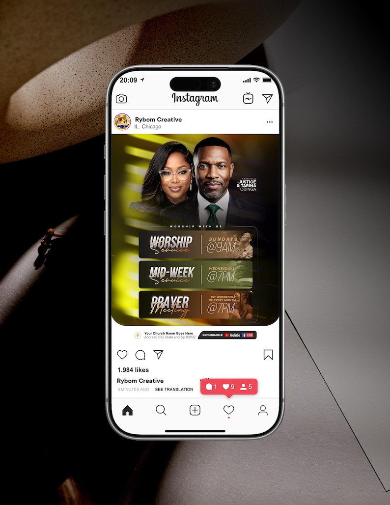 May include: A smartphone displaying an Instagram post from Rybom Creative featuring a church event flyer with photos of two people, Justice and Tarina Odinga, and text detailing worship services at 9AM Sundays and 7PM Wednesdays and prayer meetings.