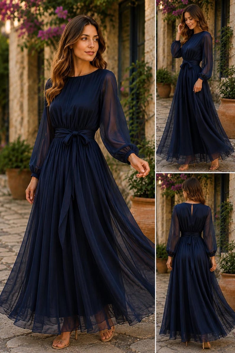 Pode incluir: Um vestido comprido azul-marinho com mangas compridas transparentes e punhos franzidos, decote redondo e cintura ajustada com um cinto de tecido a condizer. A saia &eacute; feita de tecido fluido em camadas que chega ao ch&atilde;o.