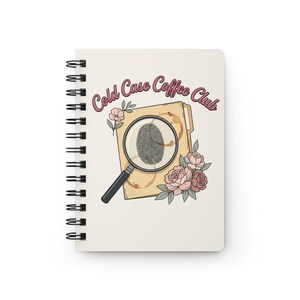May include: A spiral-bound notebook with an off-white cover featuring the text Cold Case Coffee Club in pink. The graphic includes a tan file folder with a fingerprint under a magnifying glass, coffee ring stains, and pink floral accents.