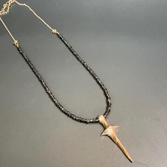 Bronze dagger on sparkling grey moonstone and gold chain
