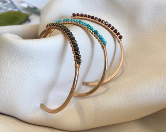 Bronze cuff with solid row of sparkling gemstones