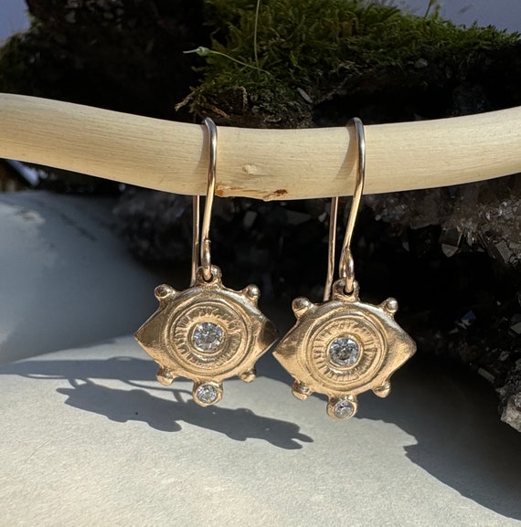 Evil eye earrings in bronze and cubic zirconia