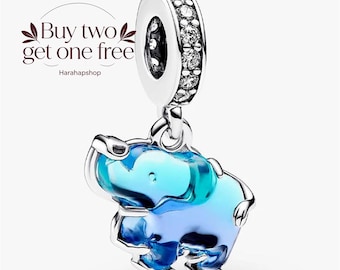 May include: A silver charm bead featuring a dangling elephant pendant with a gradient blue translucent body. The top loop is encrusted with clear stones. The text "Buy two get one free" and "Harahapshop" is visible in the upper left corner.