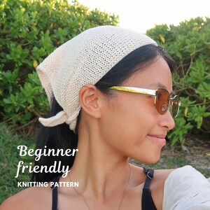 May include: A cream-colored, triangular knit headscarf tied at the back of the head. The fabric features a fine, uniform knit texture. The image includes the white text "Beginner friendly KNITTING PATTERN" overlaid on the left side of the frame.