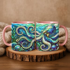 May include: Two ceramic mugs with pink handles and interiors, featuring a vibrant, stained-glass style illustration of an octopus swimming among seaweed, coral, and seashells in deep blue and teal ocean waters with bubbles.