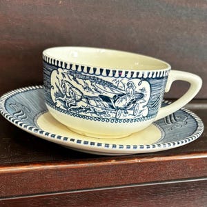 Currier And Ives blue Cup and saucer by Royal China