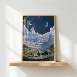 May include: A framed wall art print depicting a surreal landscape with a person sitting in a chair by a lake, surrounded by mountains and clouds under a dark night sky featuring a crescent moon, a full moon, and a vast field of stars.