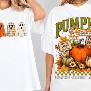 May include: A white t-shirt featuring four ghost illustrations on the front and a large graphic on the back with the text PUMPKIN PATCH, FARM FRESH, LOCALLY GROWN, AUTUMN PICKED, FRESH FROM THE PATCH, PUMPKINS, CORN MAZE, and APPLE CIDER with pumpkins.