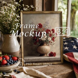 May include: A rectangular gold-toned picture frame containing a print of a floral still life with red and white flowers in a ceramic vase. The frame features the text Frame Mockup 3:4 and PSD Smart Object, set against a rustic wooden surface.