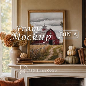 May include: A gold-toned picture frame containing a painting of a red barn in a field under a cloudy sky. The text Frame Mockup DIN A and PSD Smart Object is overlaid. The frame sits on a mantelpiece with a vase of dried flowers and pumpkins.