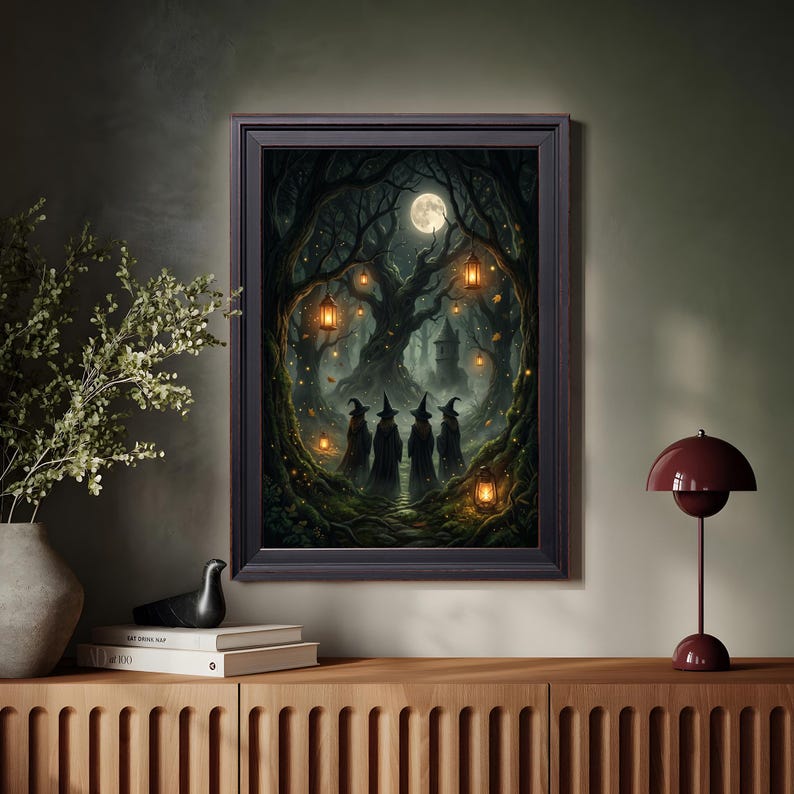May include: A framed wall art print depicting a dark, enchanted forest scene at night under a full moon. Four figures wearing pointed hats stand on a path surrounded by gnarled trees, glowing lanterns, and a distant stone tower in the background.