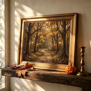 May include: A framed landscape painting depicting a forest path with golden autumn leaves and hanging lanterns. A small orange jack-o'-lantern and a brass candlestick sit on a wooden mantelpiece alongside several dried maple leaves.