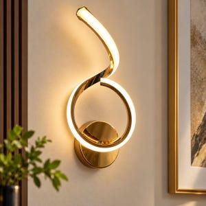 May include: A gold-toned wall sconce featuring a circular base and a continuous, spiraling light fixture. The design incorporates a curved, illuminated LED strip that forms a loop and extends upward in a graceful, twisting motion, emitting a warm glow.
