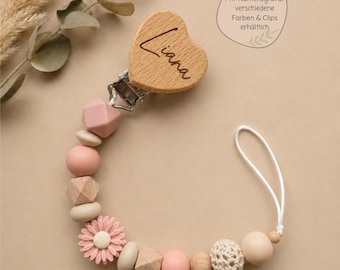 Corrente para chupeta personalizada com nome gravado em um desenho floral, várias cores e prendedores para meninos e meninas, inclui sacola de presente.