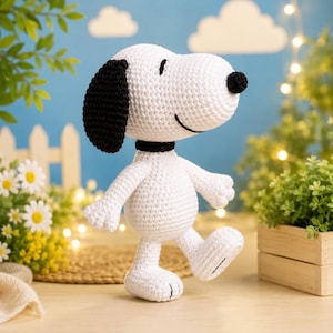 May include: A handmade white crochet Snoopy figure with black ears, a black nose, and a black collar. The figure is walking with one leg raised. The background is a light blue with white clouds and decorative lights.