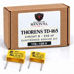 May include: A brown cardboard box labelled Quantum Revival Thorens TD-165 Circuit B 330 nF Electronics Service Kit 110-120 V, accompanied by two yellow rectangular capacitors with metal pins, marked 0.33 uF and 0.01 uF respectively.