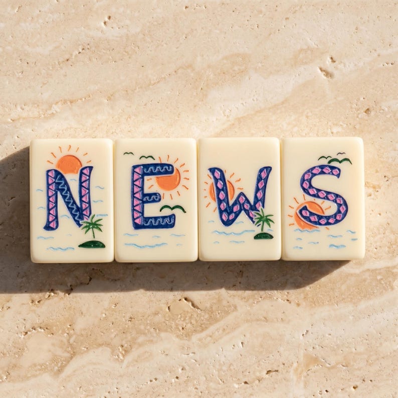 May include: Four off-white rectangular tiles arranged horizontally, each featuring a hand-painted letter spelling NEWS. Each tile displays a tropical scene with a bright orange sun, blue ocean waves, a small green palm tree, and a dark blue letter.